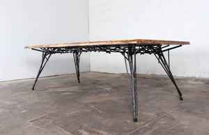 Photo of the Birdsnest Table made out of an ebonized white ash top and blackened steel base that resembles the branches of a birdsnest.